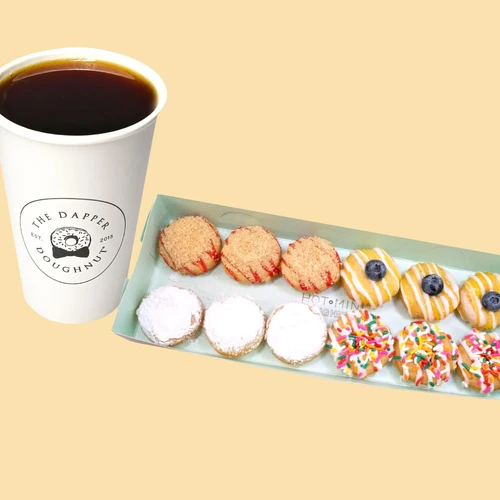 Mini 12 Coffee Combo — a Dapper Doughnut branded cup of hot coffee beside a 12-count tray of assorted mini doughnuts