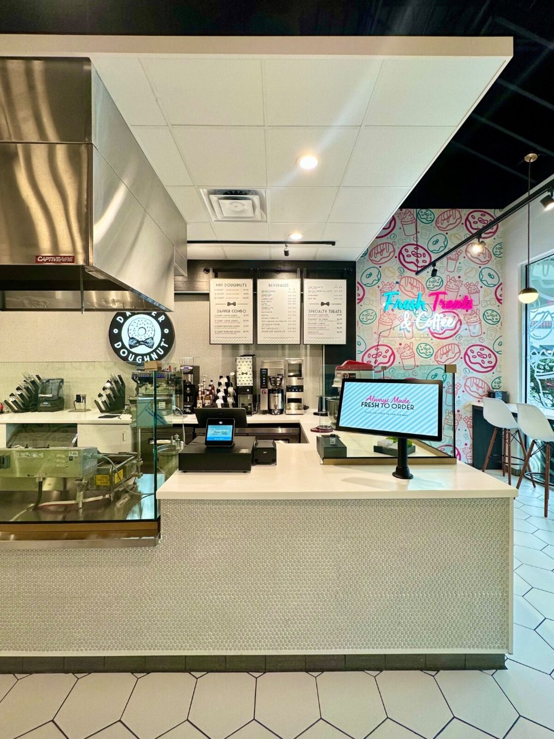 Dapper Doughnut counter with the Always Made Fresh to Order kiosk screen